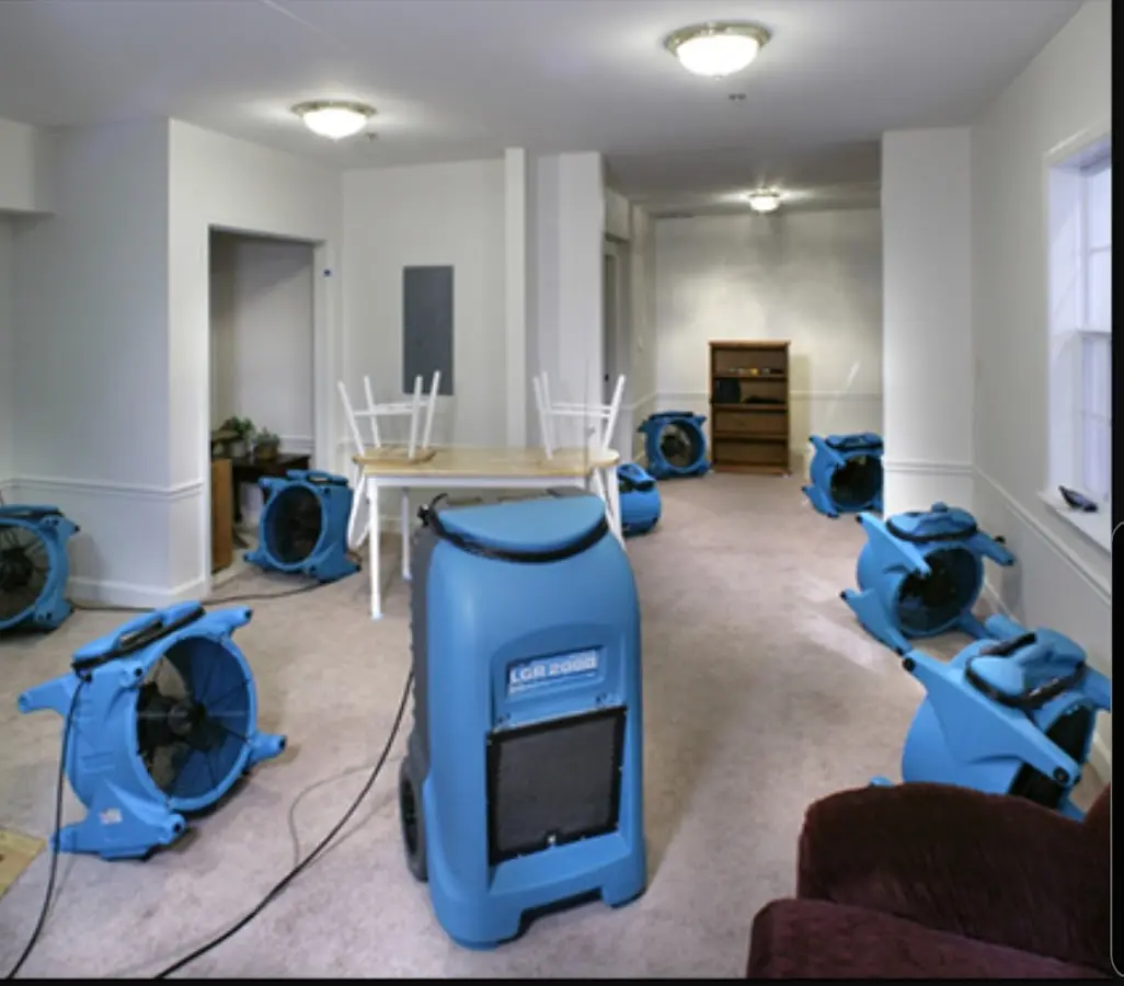 Air movers and dehumidifier setup for Water Damage Restoration in Moon